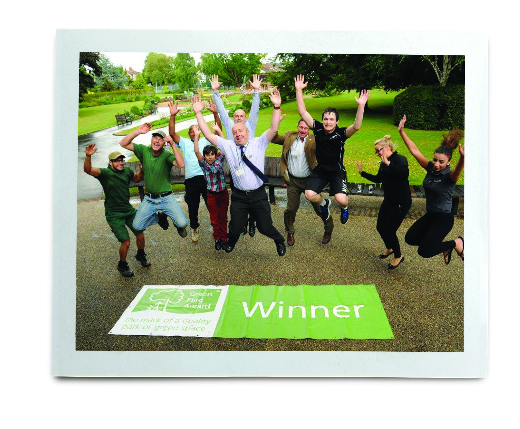 An image of people celebrating winning a Green Flag Award