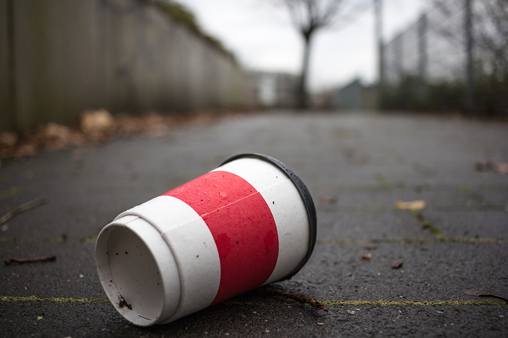 An image of a littered coffee cup