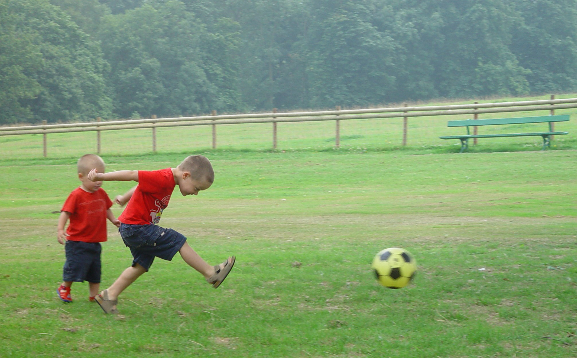 Children playing football in the park