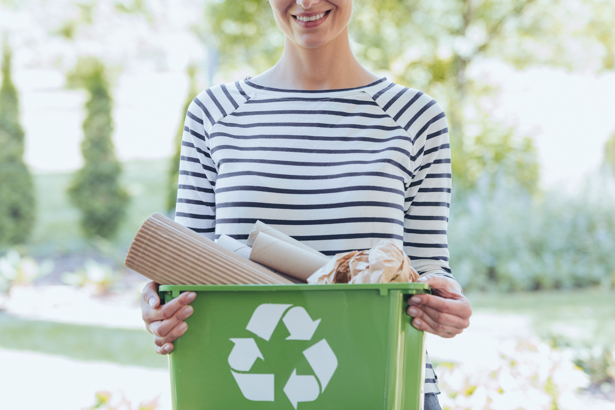 An image of a woman recycling