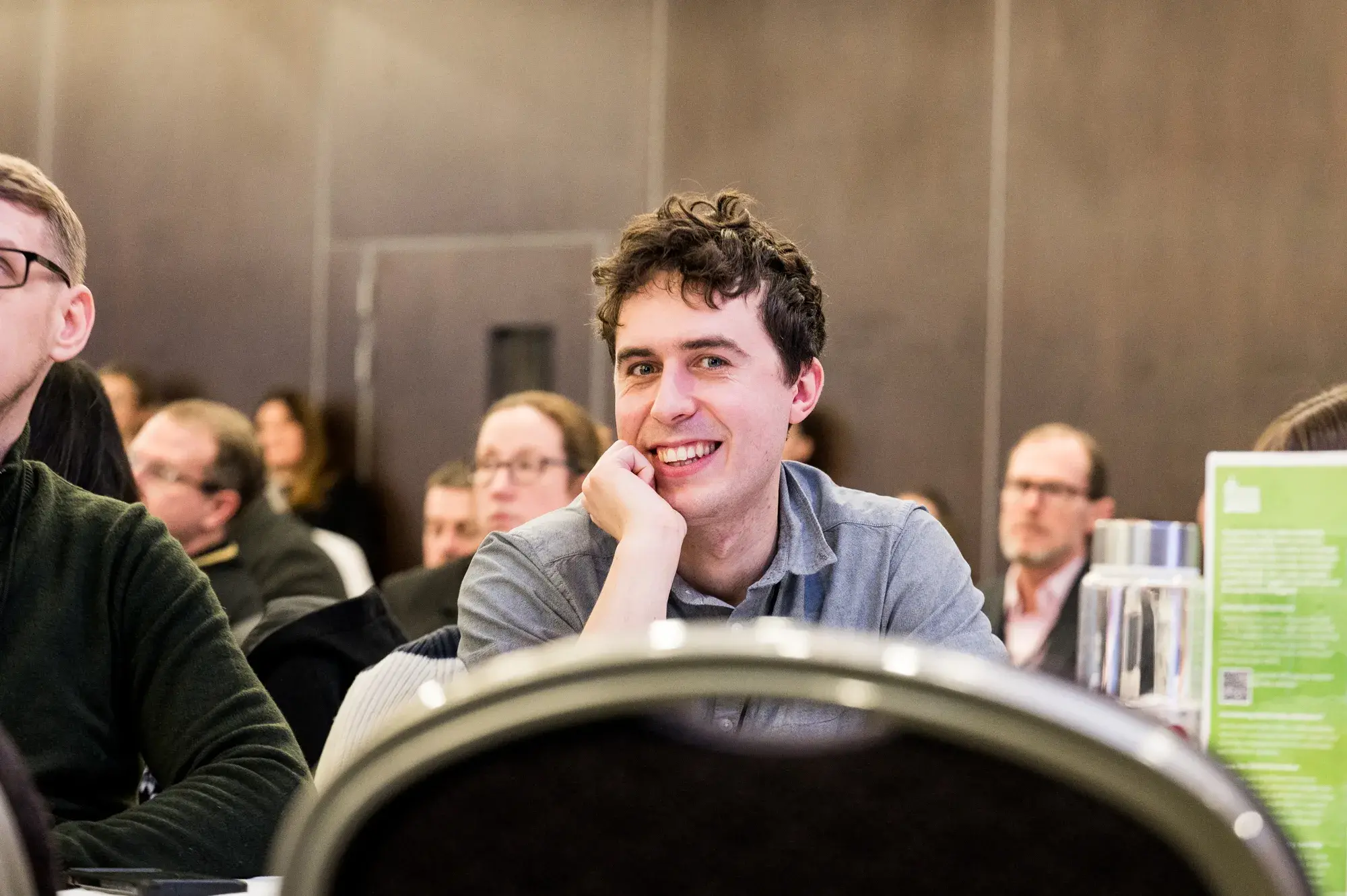 Man smiling at conference