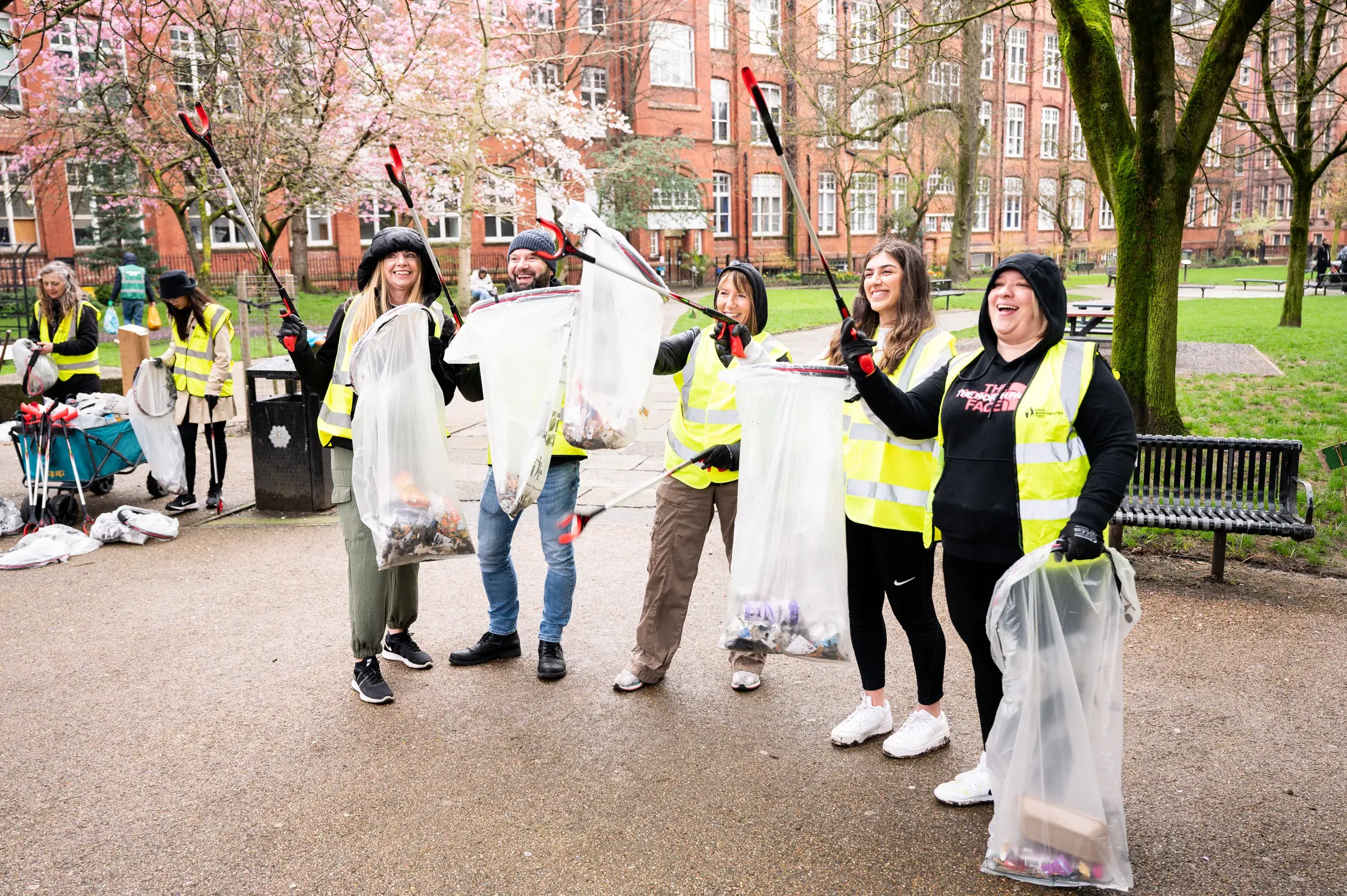 Group of litter picking volunteers cheering