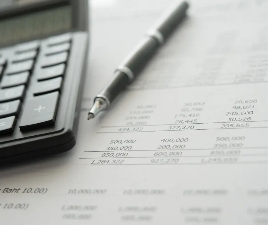 Picture of calculator, pen and spreadsheet