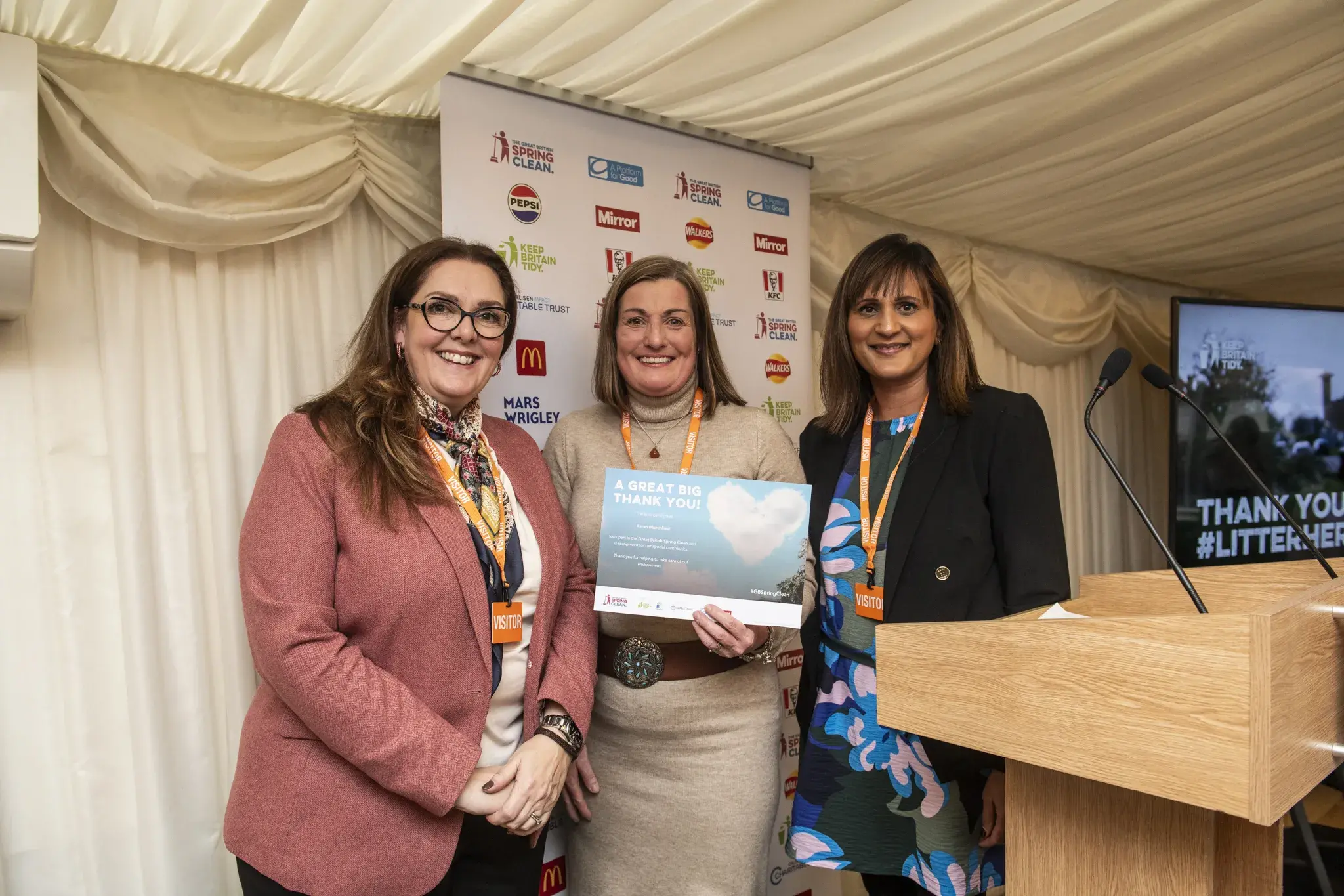 three females accepting an award