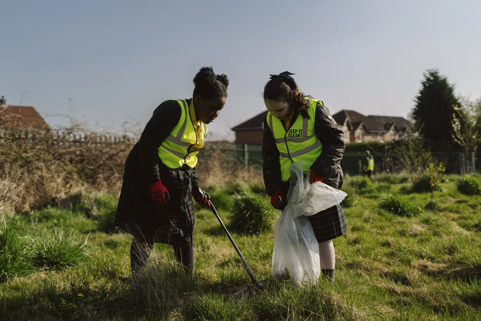 Two school pupils litter-picking