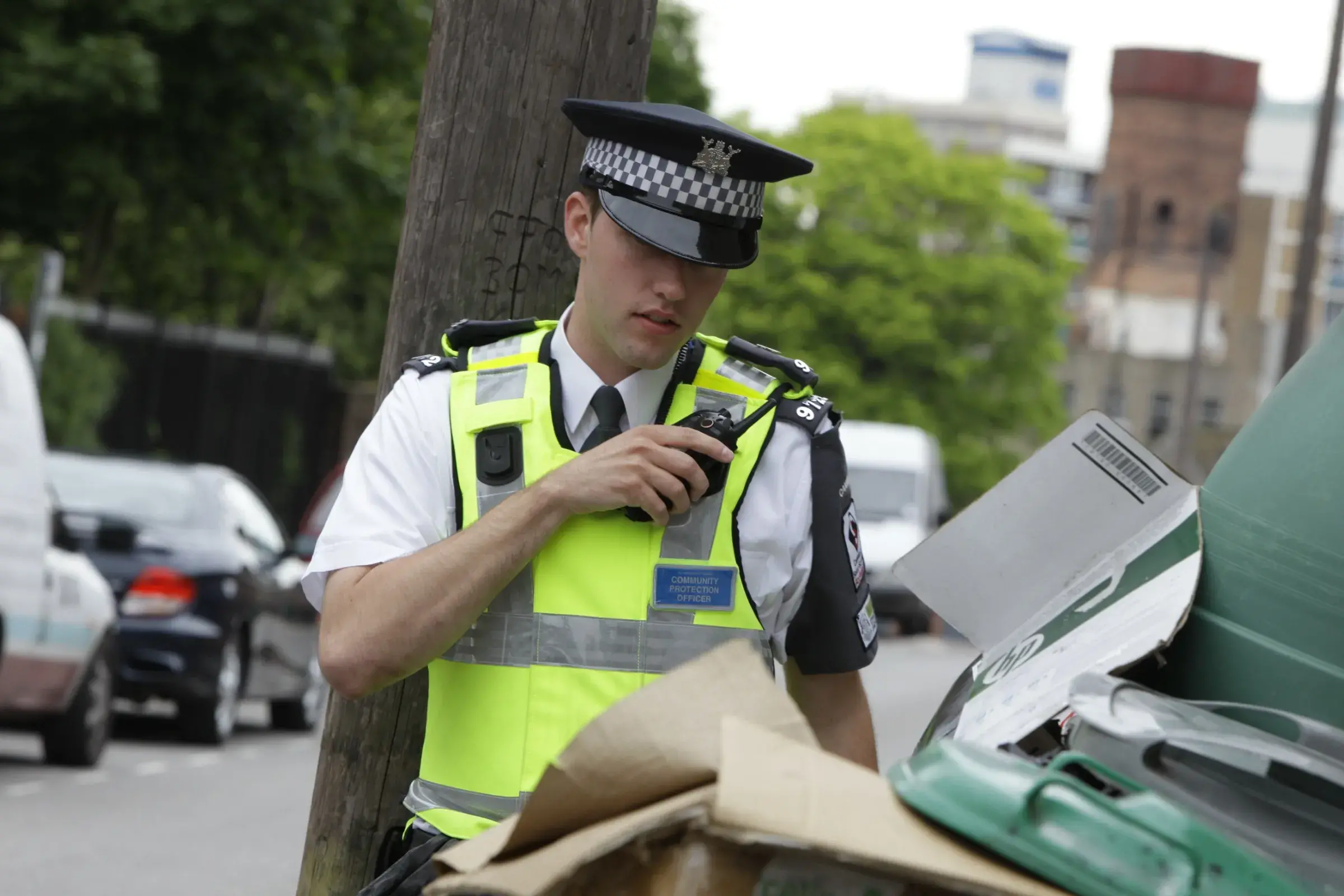 Community Protection Officer investigating potential environmental crime on street