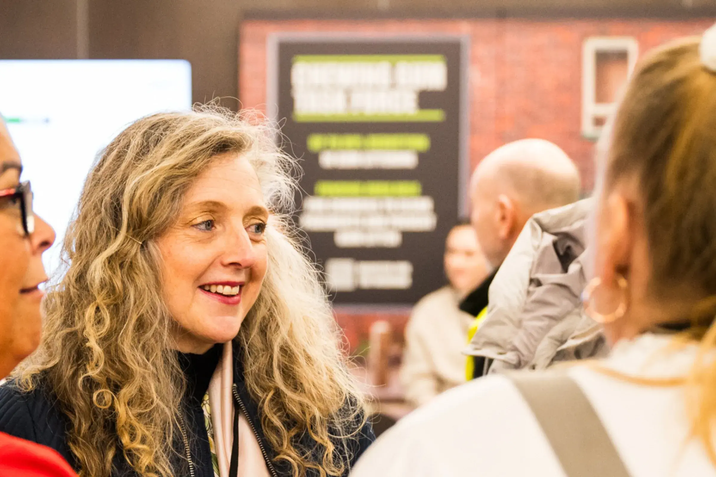 Delegates talking in exhibition hall at the Keep Britain Tidy Network Conference