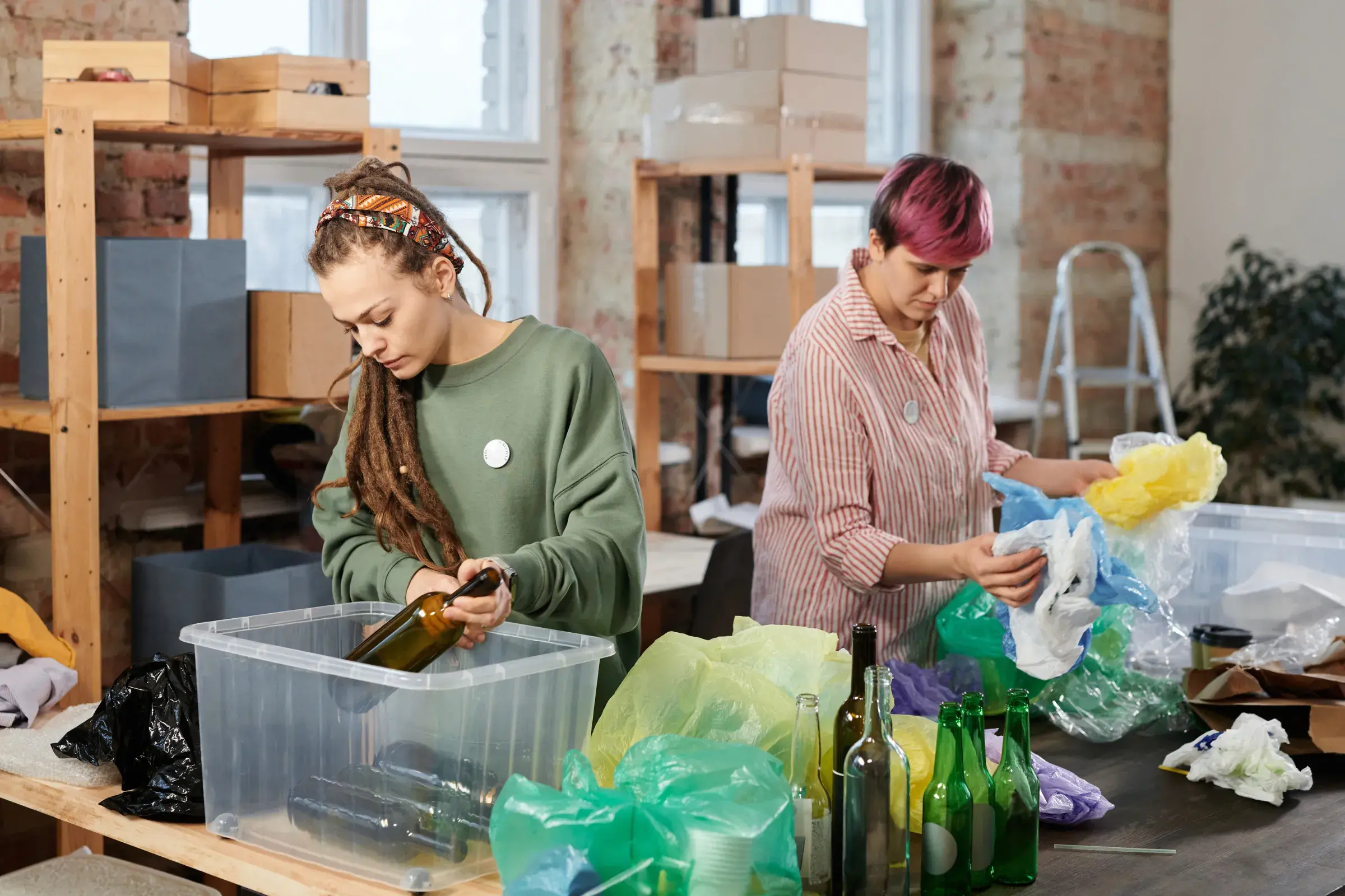 two females sorting items for reuse